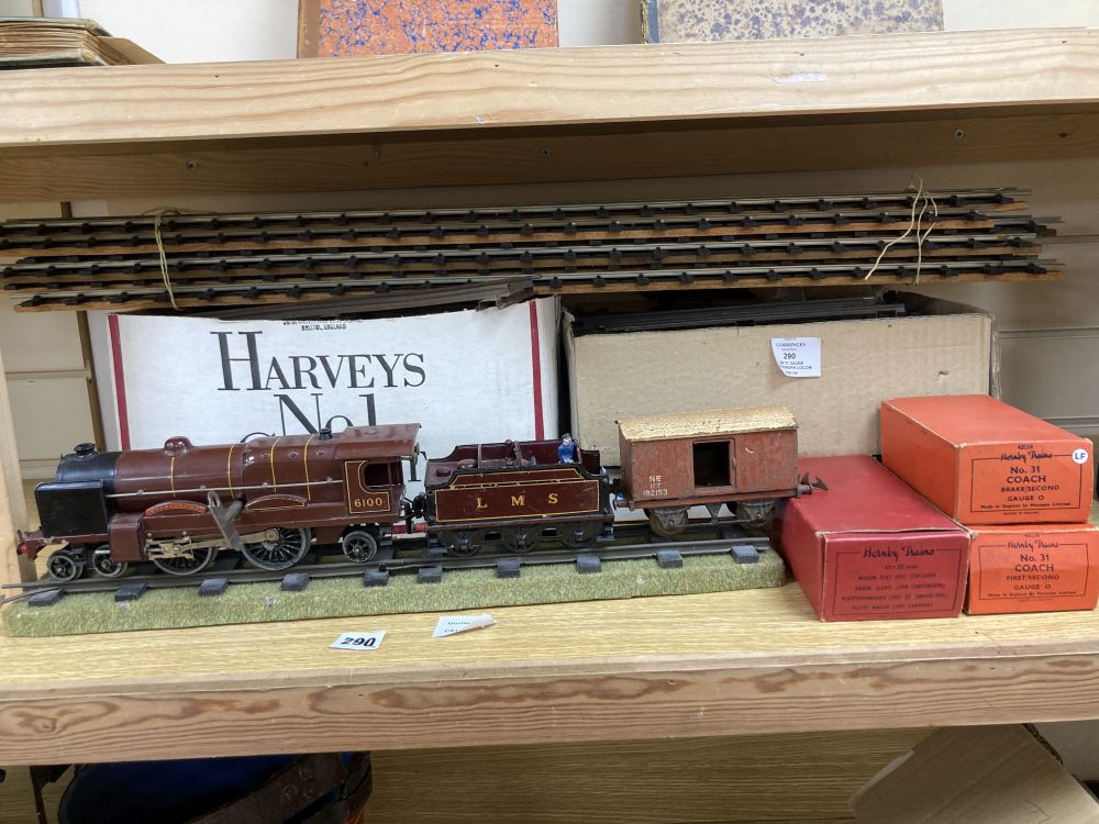 A Hornby O gauge Royal Scot 6100 clockwork locomotive and tender, two no. 31 coaches and a Flat truck, and a quantity of track